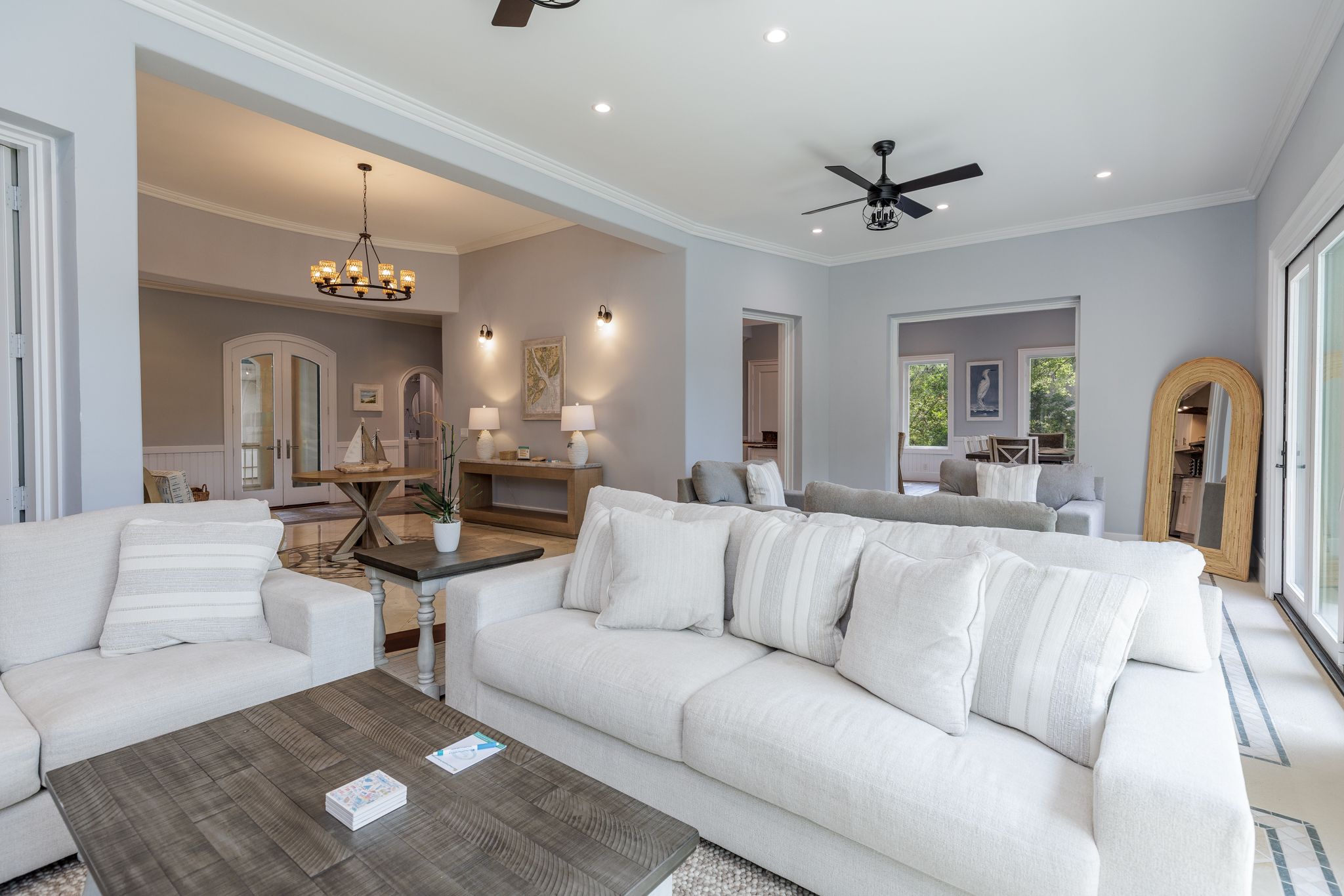 Great room with white sofas and natural light at the Hilton Head estate