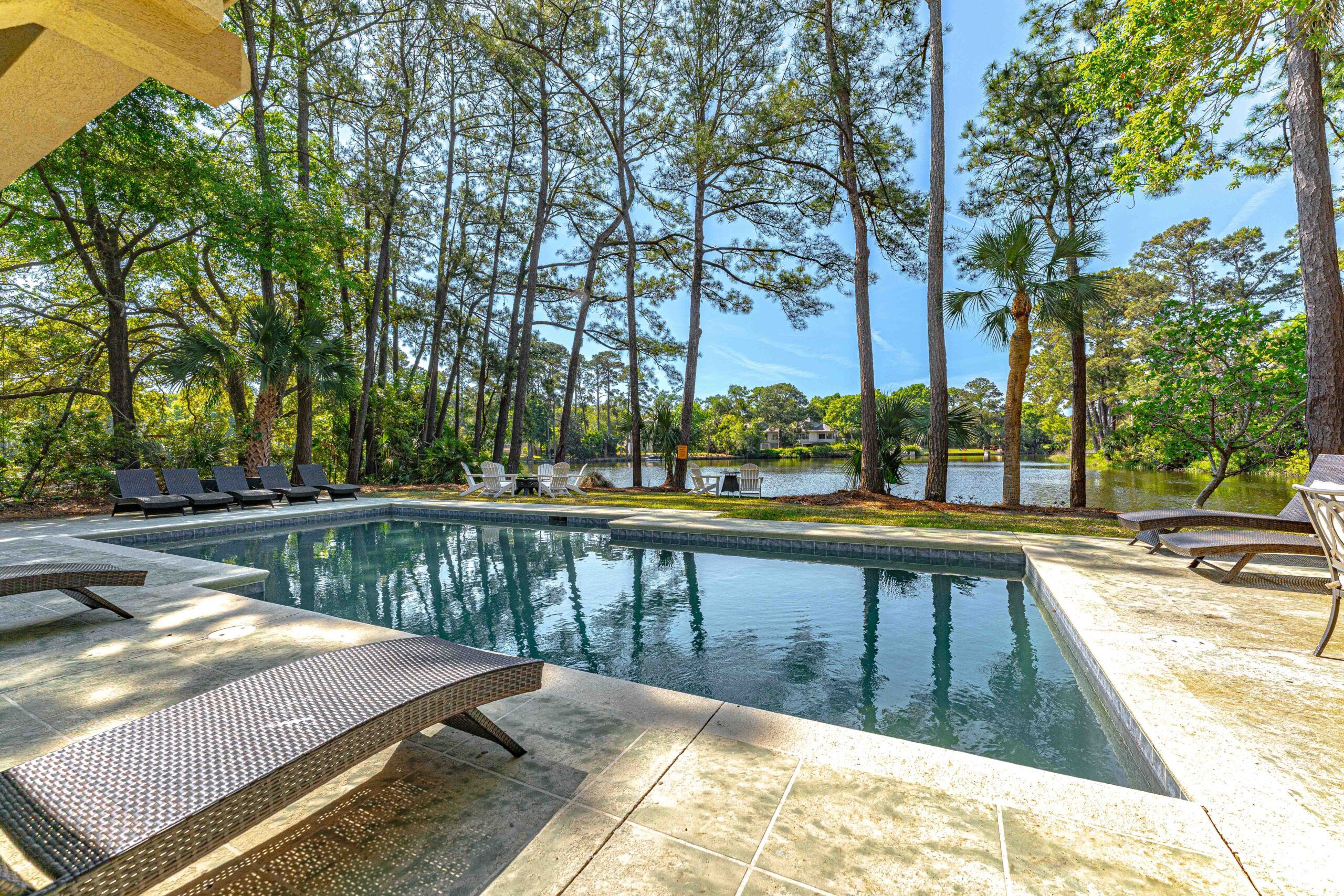 Poolside lounger looking out over the lagoon at the Palmetto Dunes estate