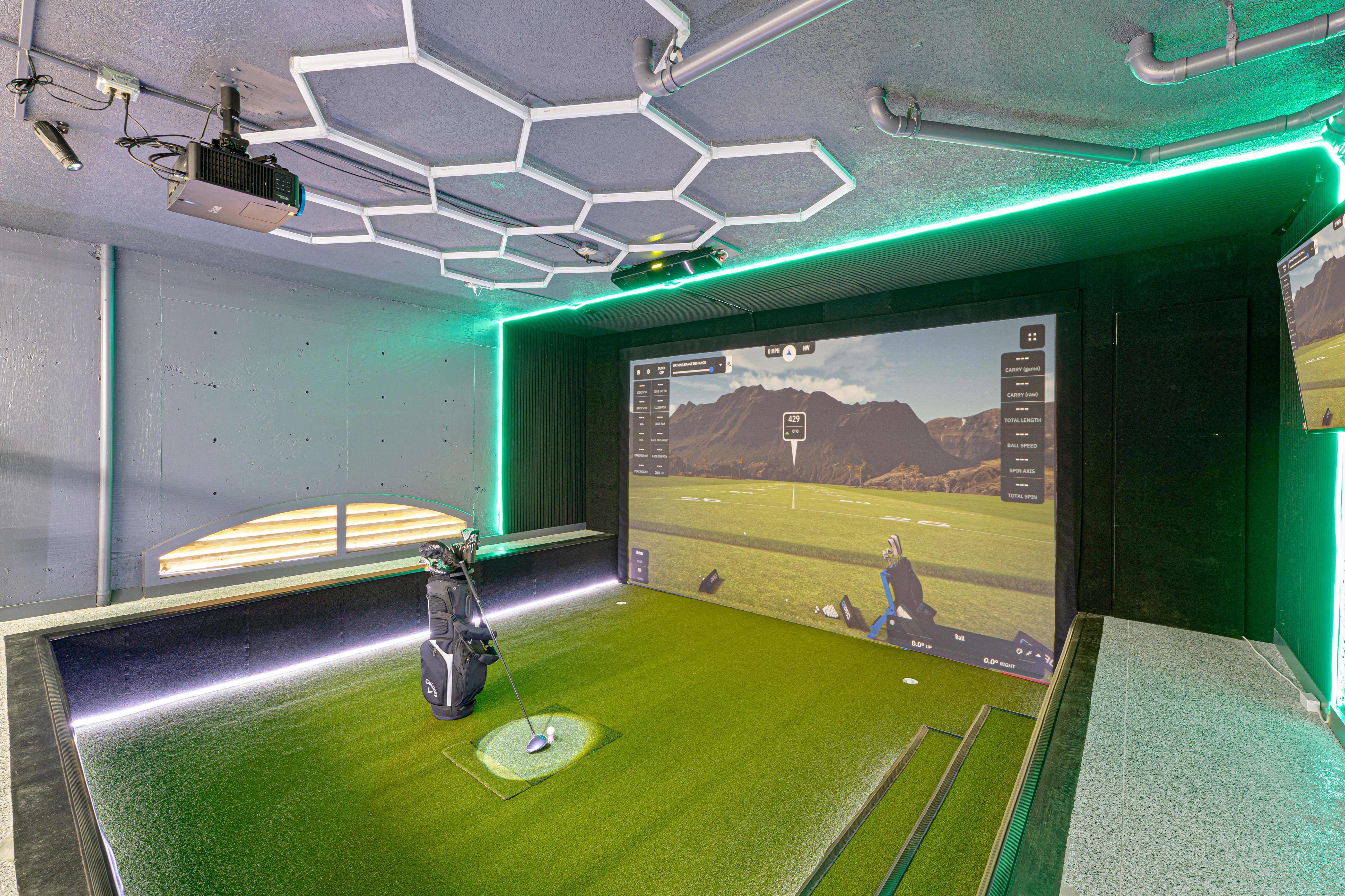 Ground-level rec room with games and lounge seating at the estate