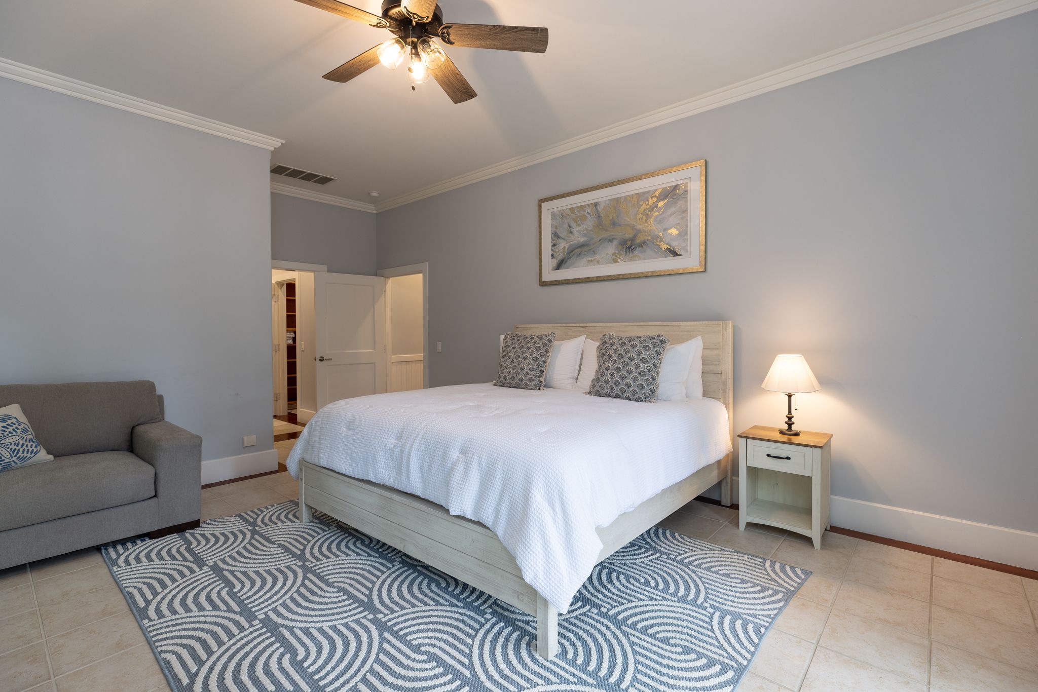 King suite with coastal styling in the quiet wing of the estate